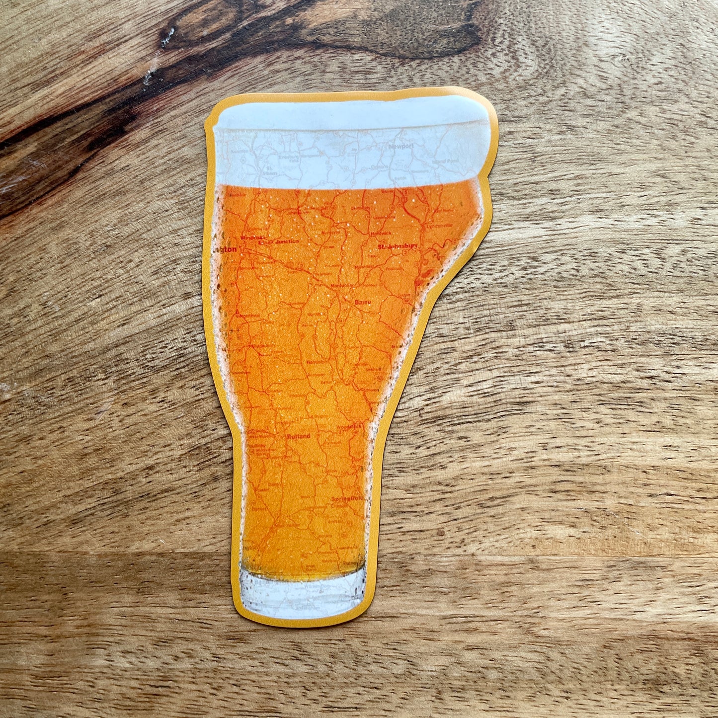 Vermont-shaped beer magnet